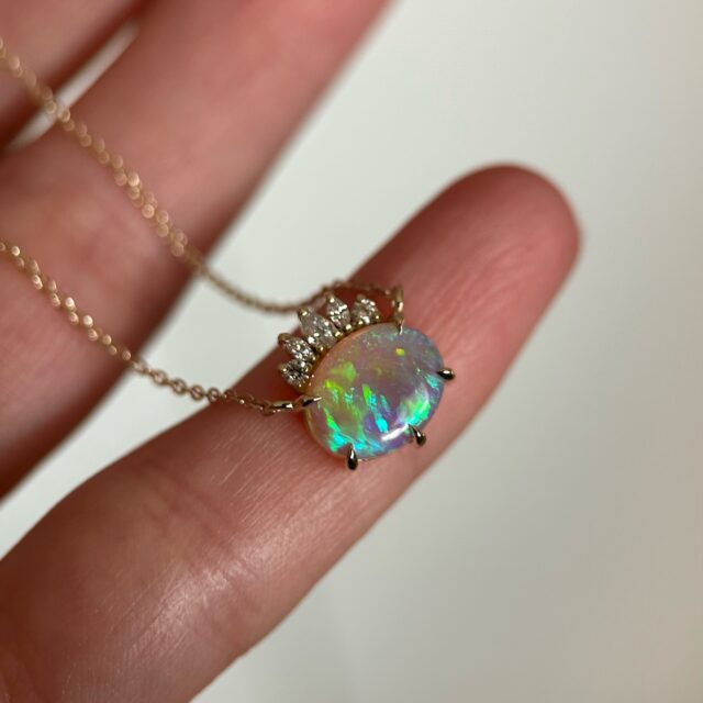 14K Yellow gold necklace with Australian Crystal Opal & Diamonds 💚💜💙 Available on our website