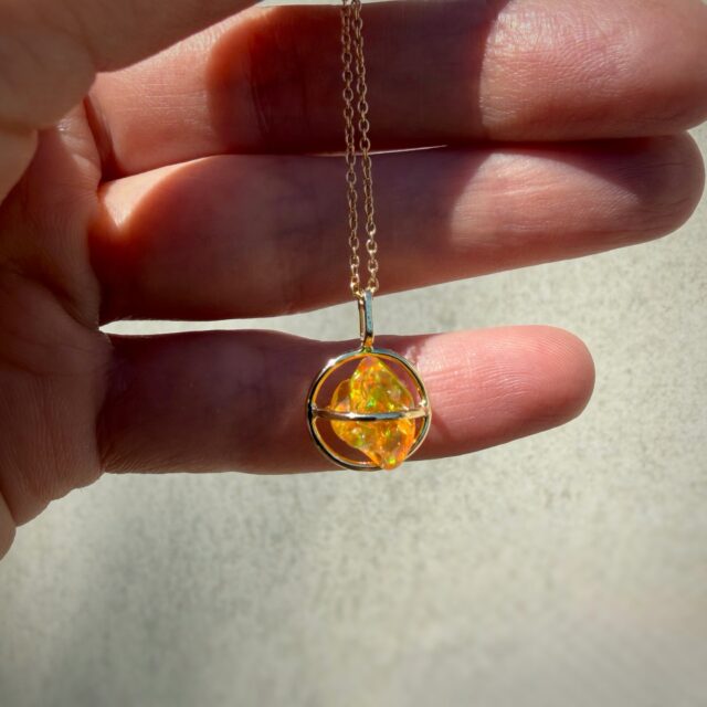 14K Yellow gold Planet pendant with Mexican Freeform Fire Opal 🔥 Available on our website