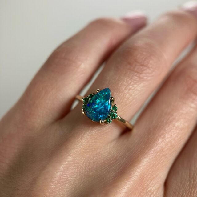 14K Yellow gold ring with Australian Black Opal and Emeralds 💚 SZ 7. Available on our website